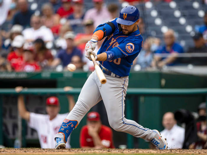 Sep 5, 2021; Washington, District of Columbia, USA; New York Mets right fielder Michael Conforto (30) hits an RBI double against the Washington Nationals during the ninth inning at Nationals Park.